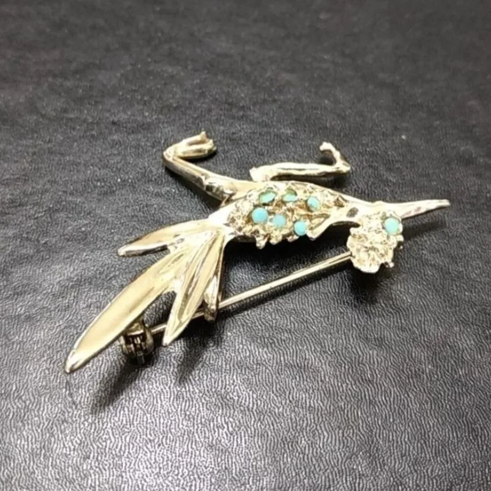 Silver tone vintage roadrunner brooch.
